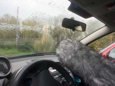 Storm and rain on car windshield