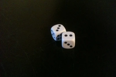 Two dice on wooden table