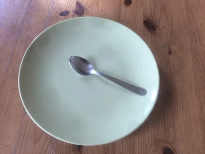 Teaspoon, placed on a plate