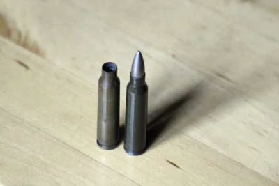 Cartridge case 5.56mm on concrete 1