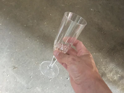 Broken glass of champagne